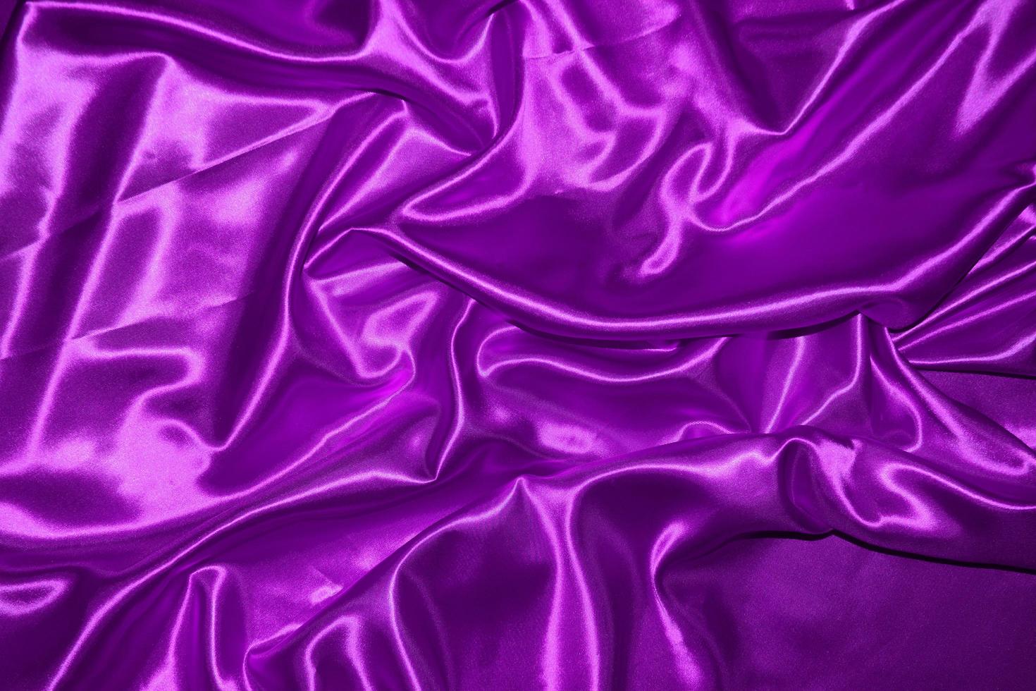 abstract purple fabric background with soft waves photo