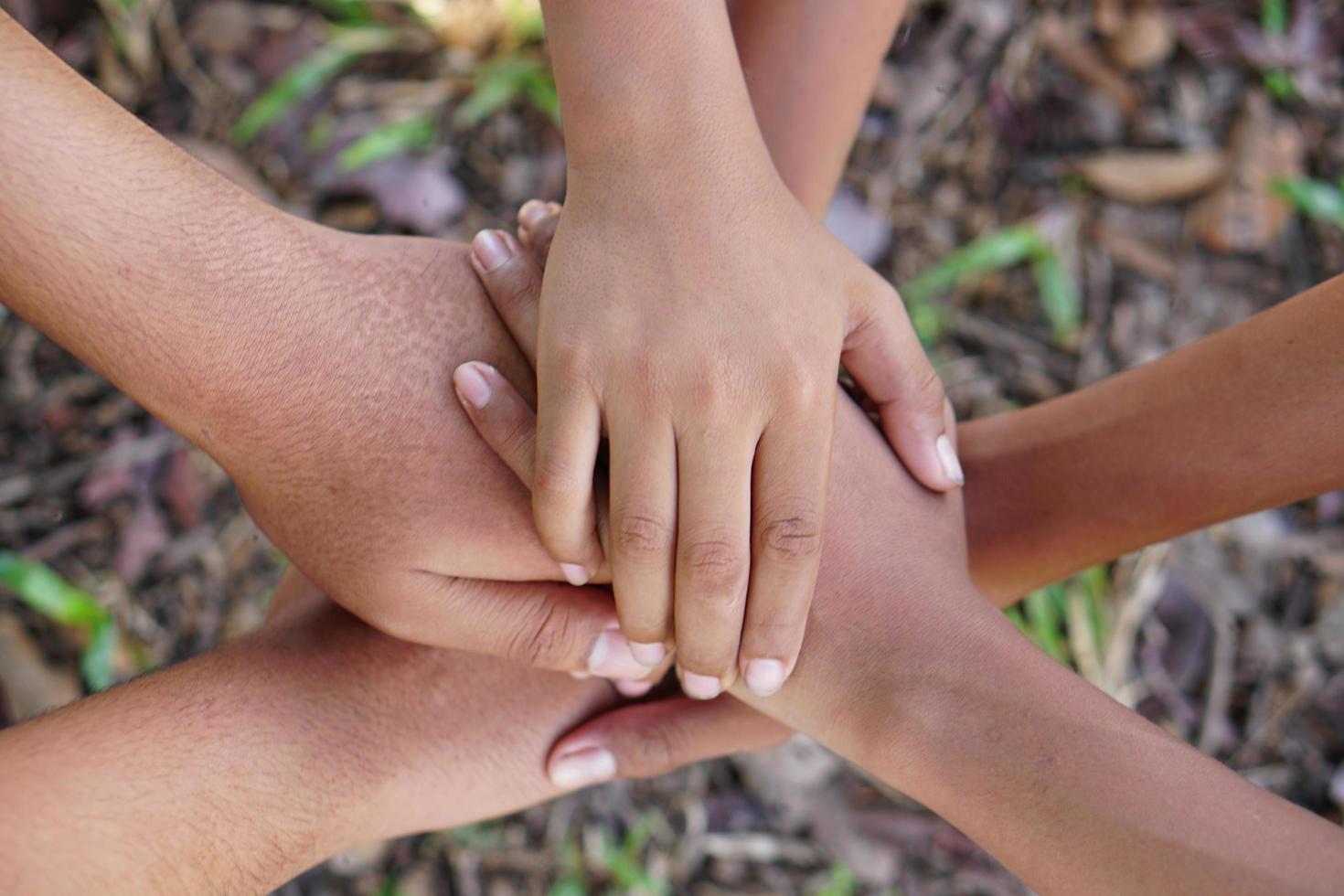 High five team work as a team together, air hands bless the power tag team. Multi-ethnic groups Unity together in the volunteer community. Cooperation Business team success concept. photo