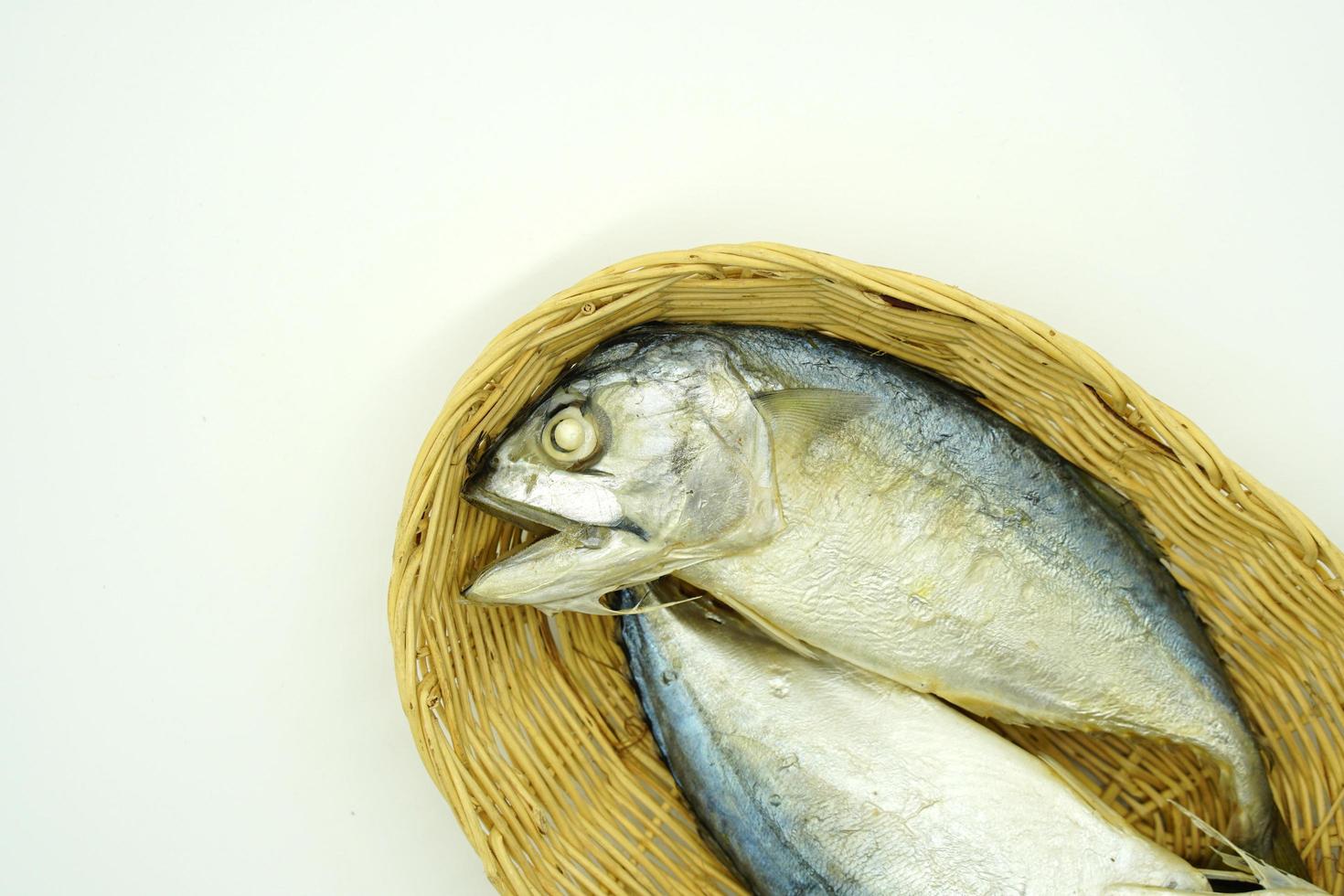 Steamed mackerel in a rattan tray photo