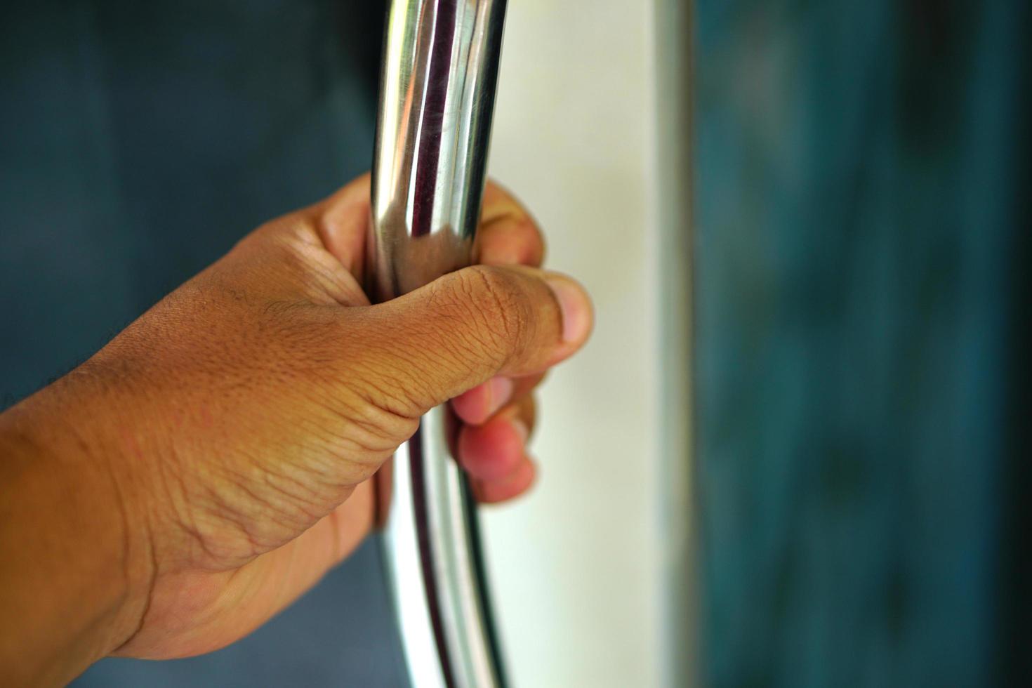 human hand opening the door photo