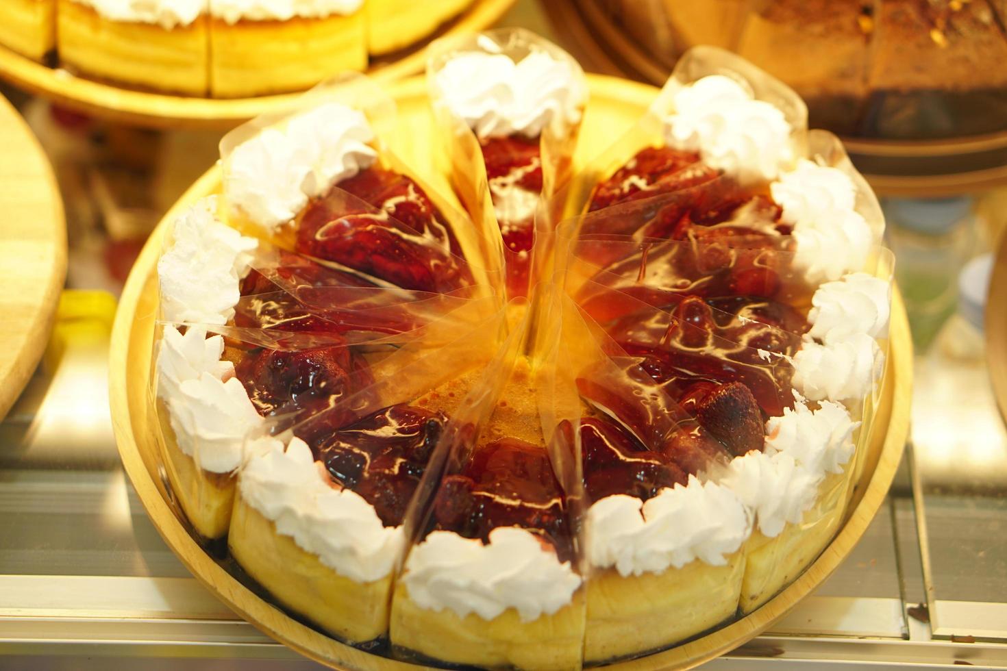 cake in glass cabinet cut into pieces Sold in a coffee shop photo