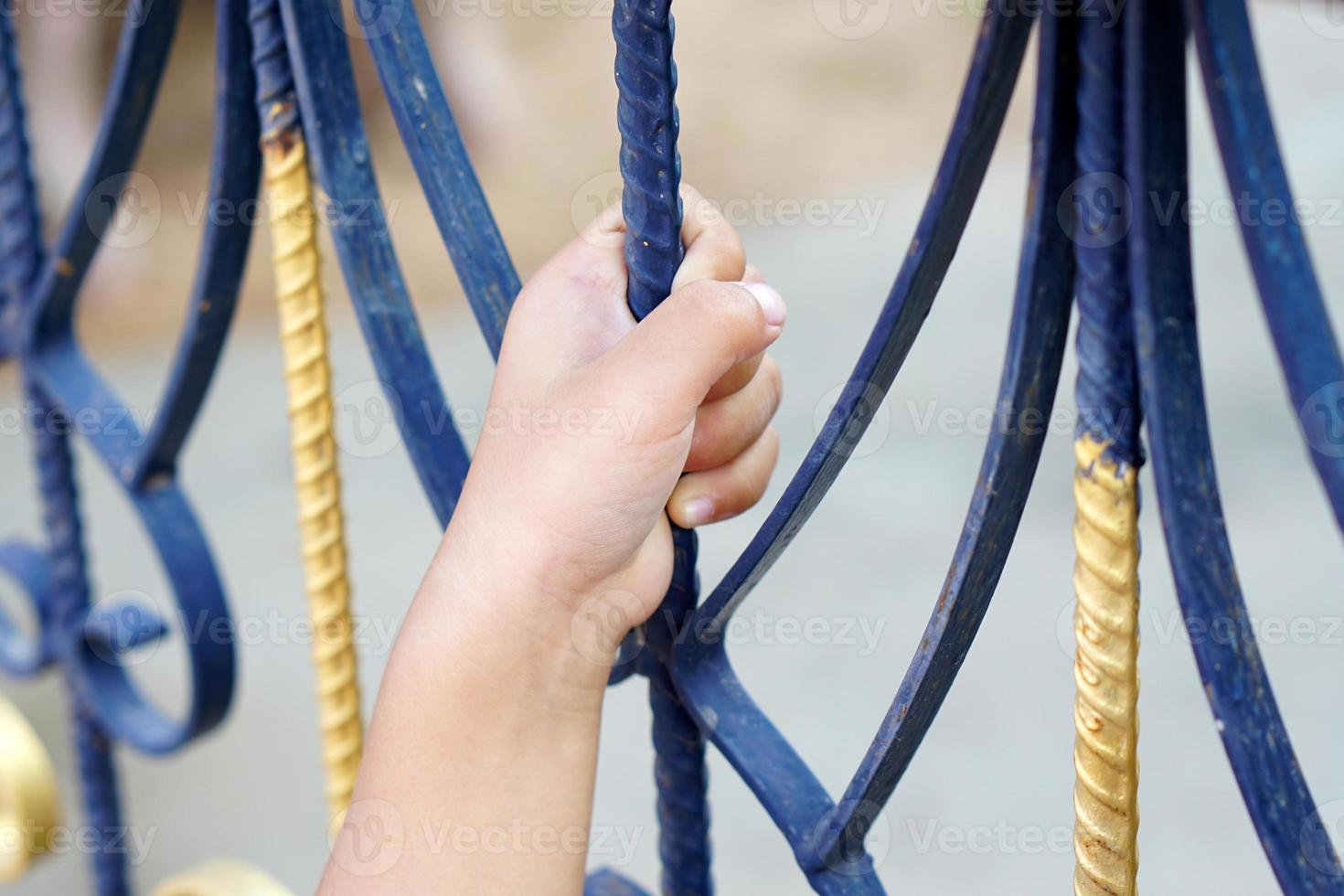 child's hand touched the door of the house because he couldn't get out. photo