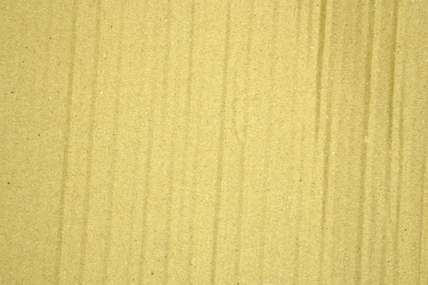 Paper brown texture light rough textured spotted blank copy space background in yellow photo