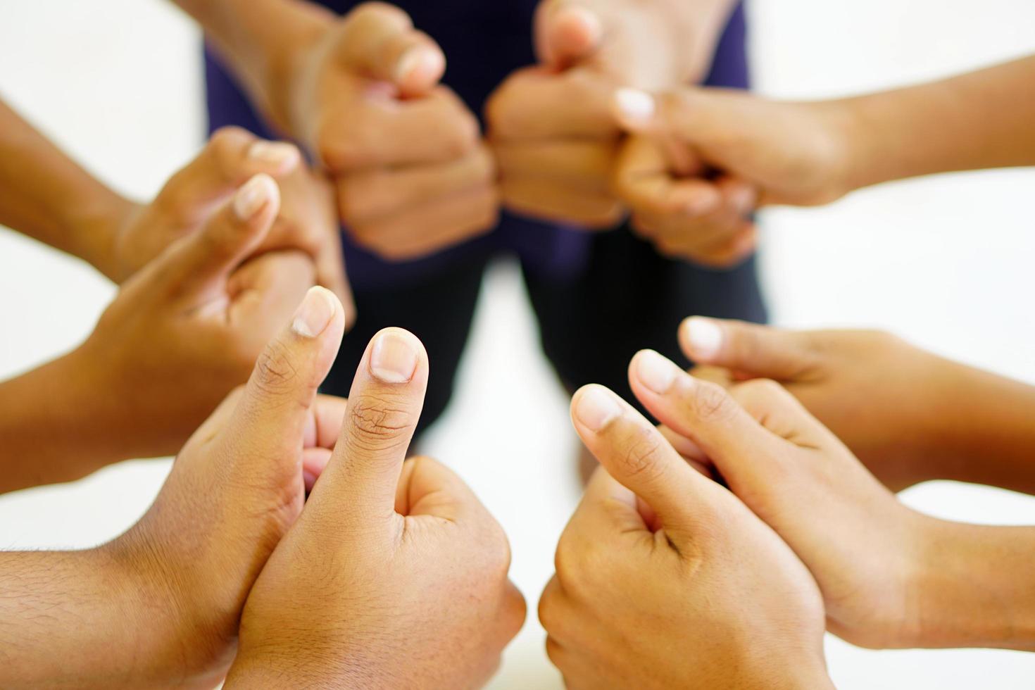 High five team work as a team together, air hands bless the power tag team. Multi-ethnic groups Unity together in the volunteer community. Cooperation Business team success concept. photo
