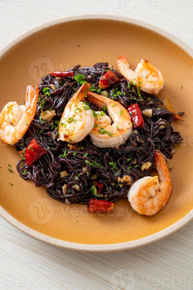 stir-fried black spaghetti with garlic and shrimps photo