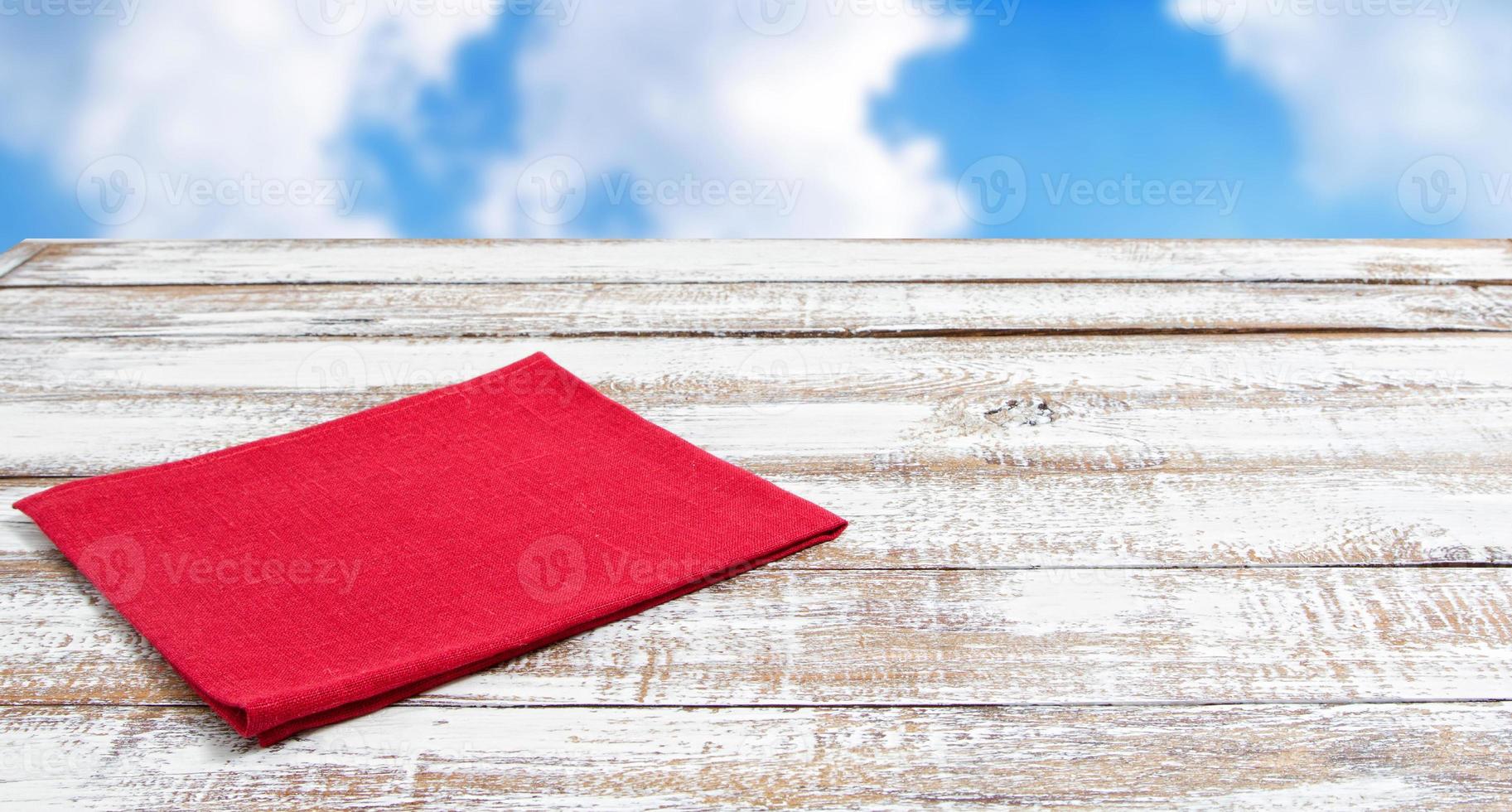 coloured napkins on empty wooden table - top view, copy space photo