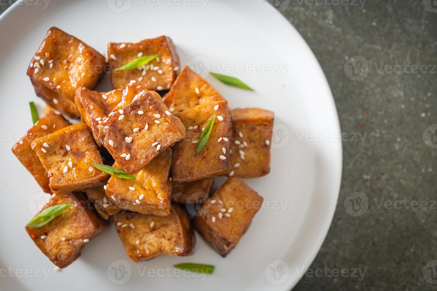 fried tofu with white sesame and teriyaki sauce photo