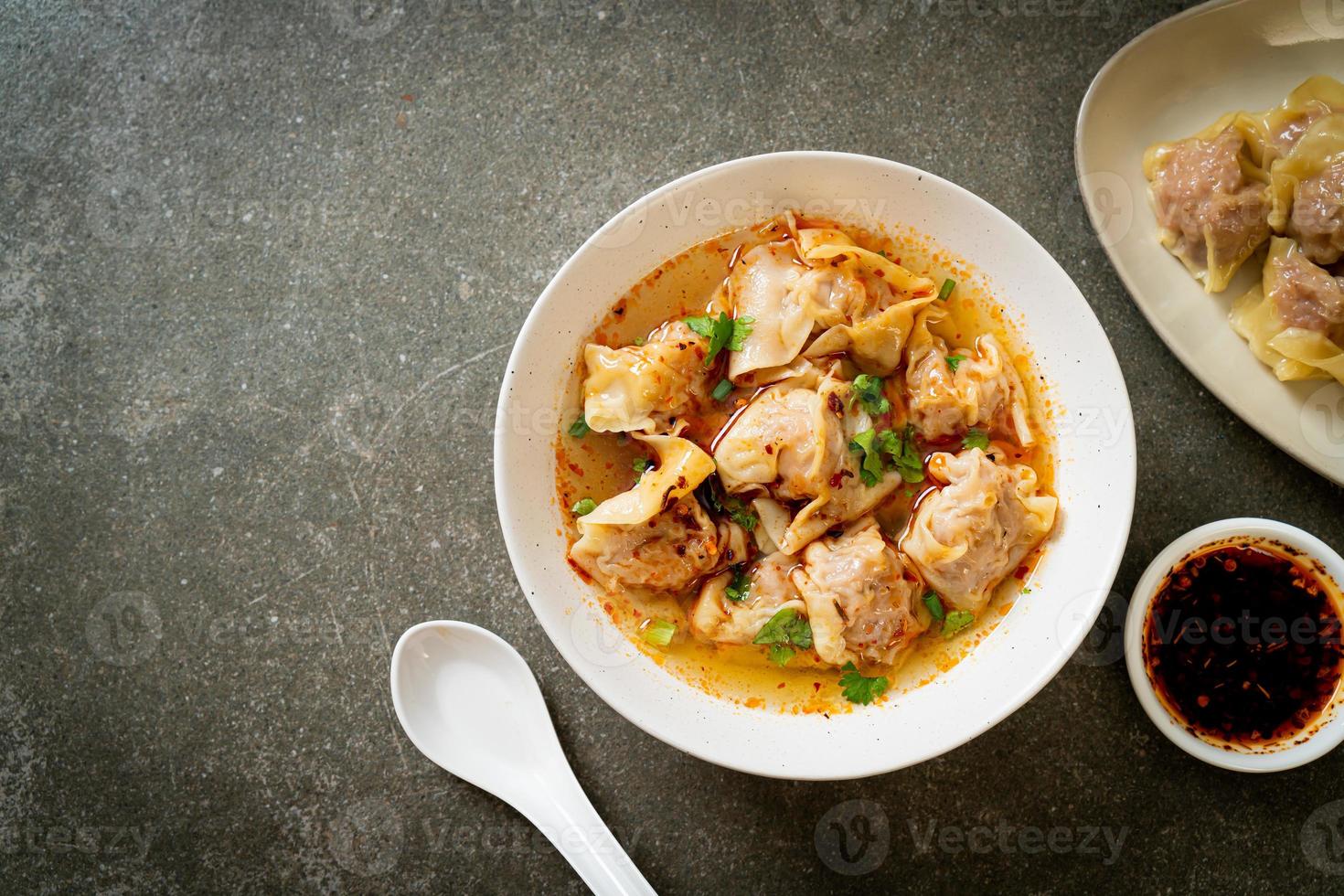 pork wonton soup or pork dumplings soup with roasted chili photo