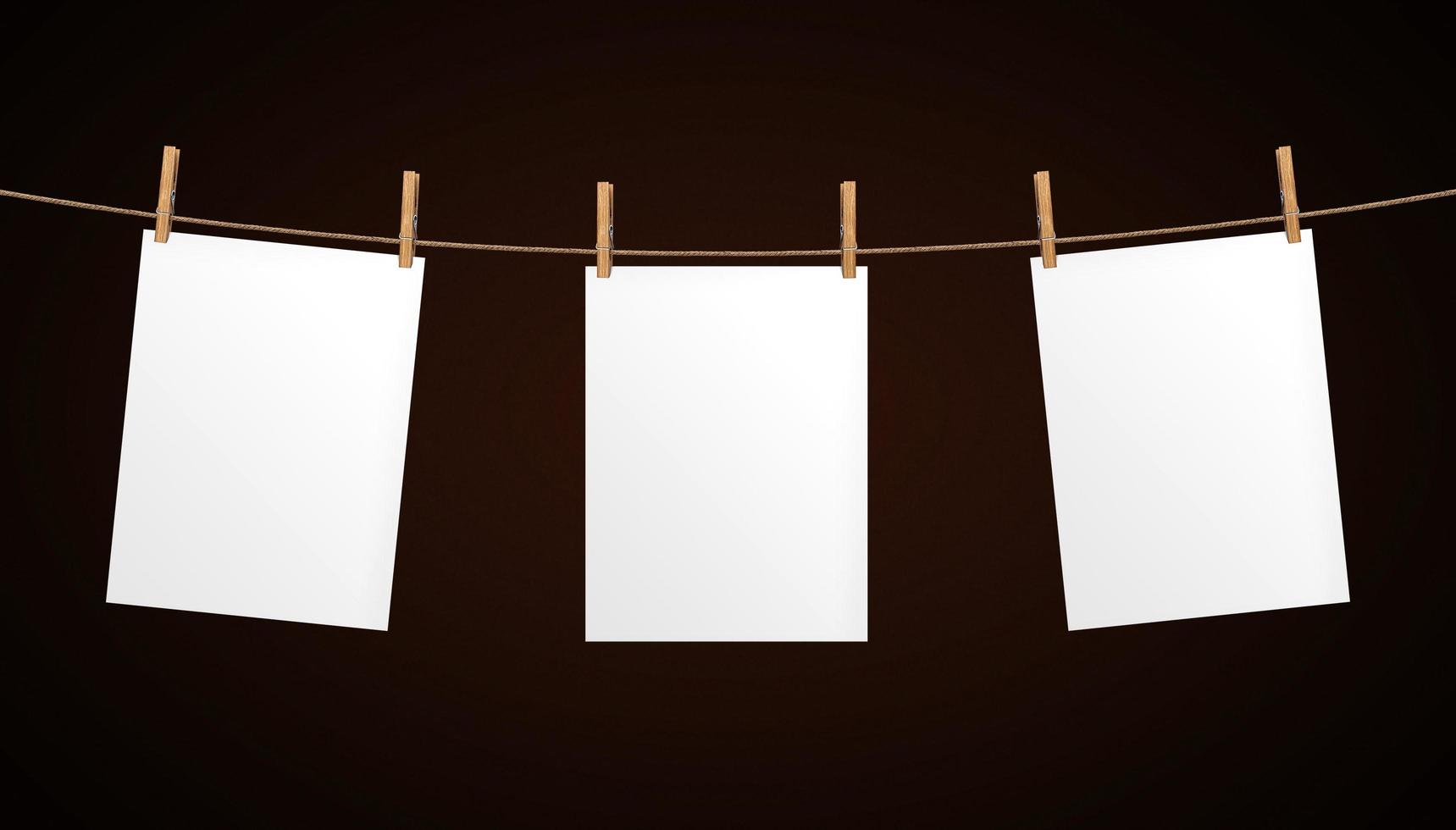 Empty paper sheet hanging on rope photo