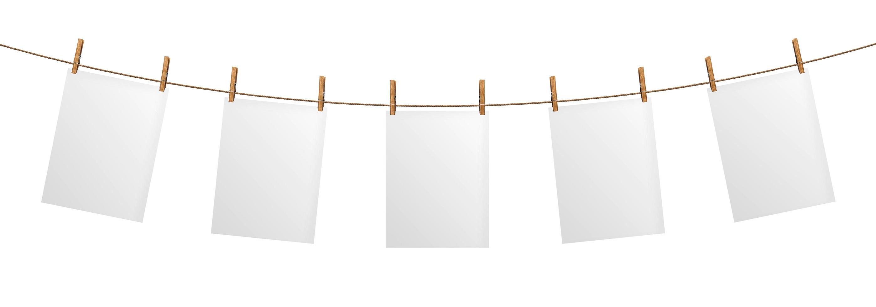 Empty paper sheet hanging on rope, isolated on white background photo