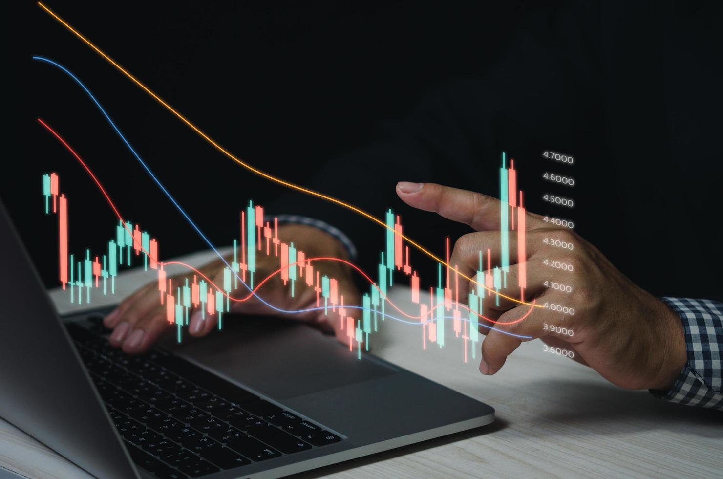 Finance and business investment concept. Stock and crypto investment funds.Businessman analyzing or trading Forex graphs of financial data candlestick chart. photo