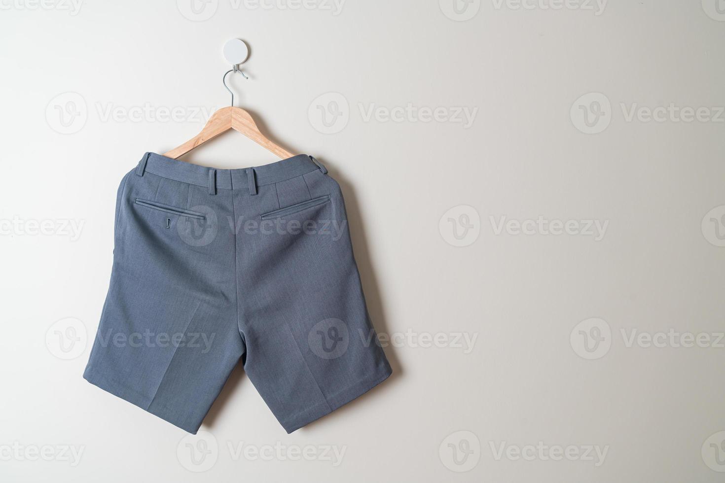 short pants hanging on wall photo