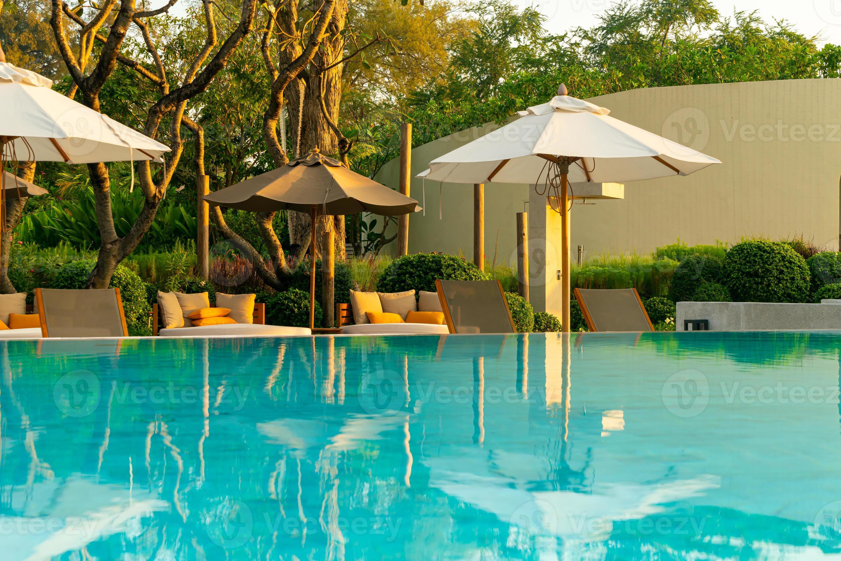 umbrella with bed pool around swimming pool with ocean sea background