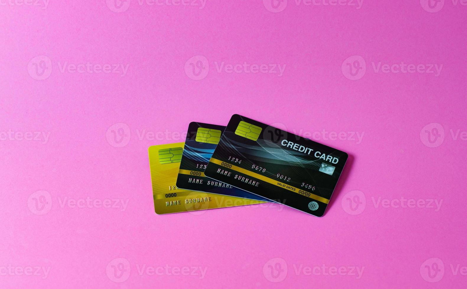 Credit card on pink background photo