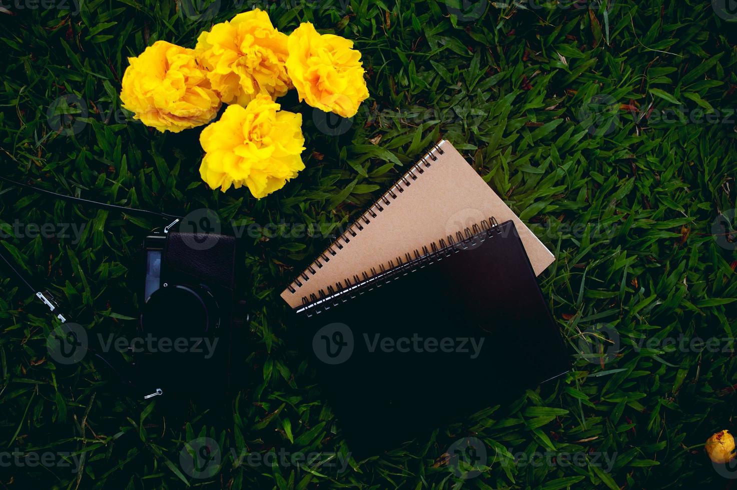 Notebooks and cameras Top angle shot, shadow picture, soft light photo