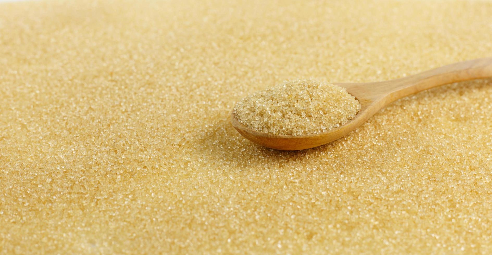 Spoon of brown sugar photo