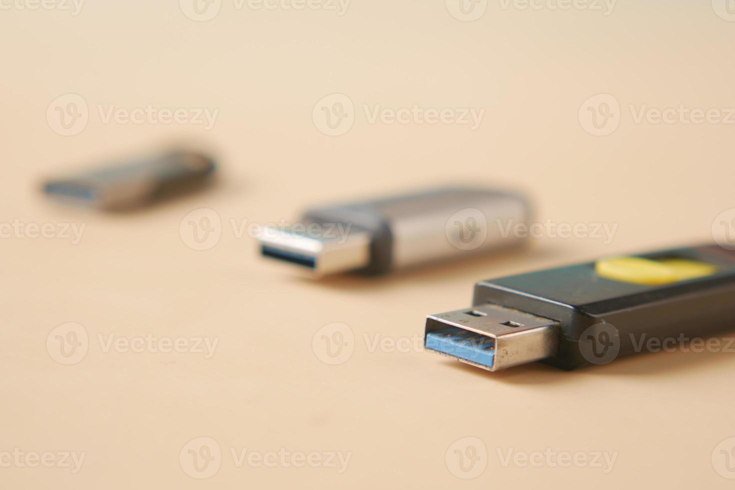 USB flash drive on blue background close up photo