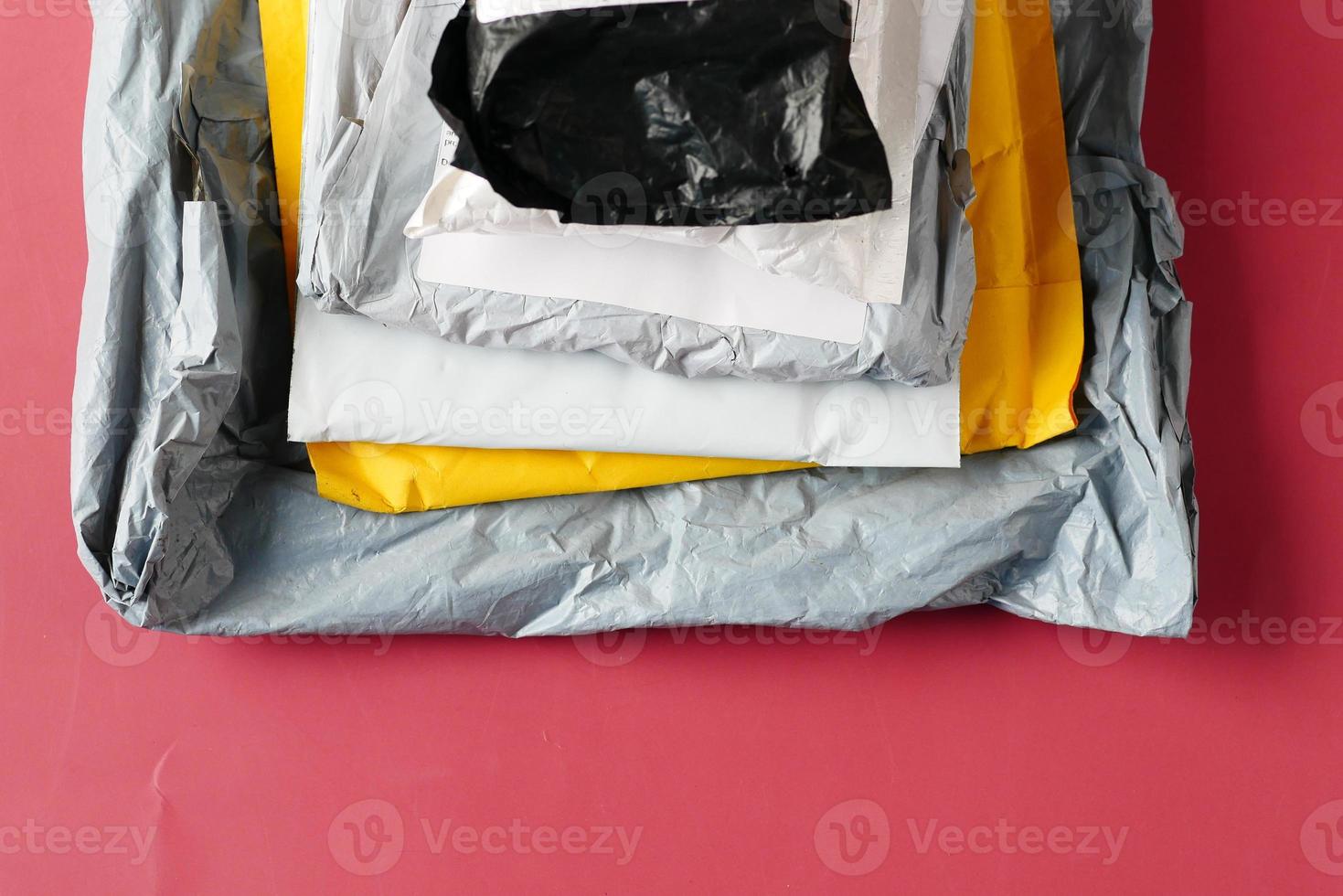 top view of delivery packages on red background photo