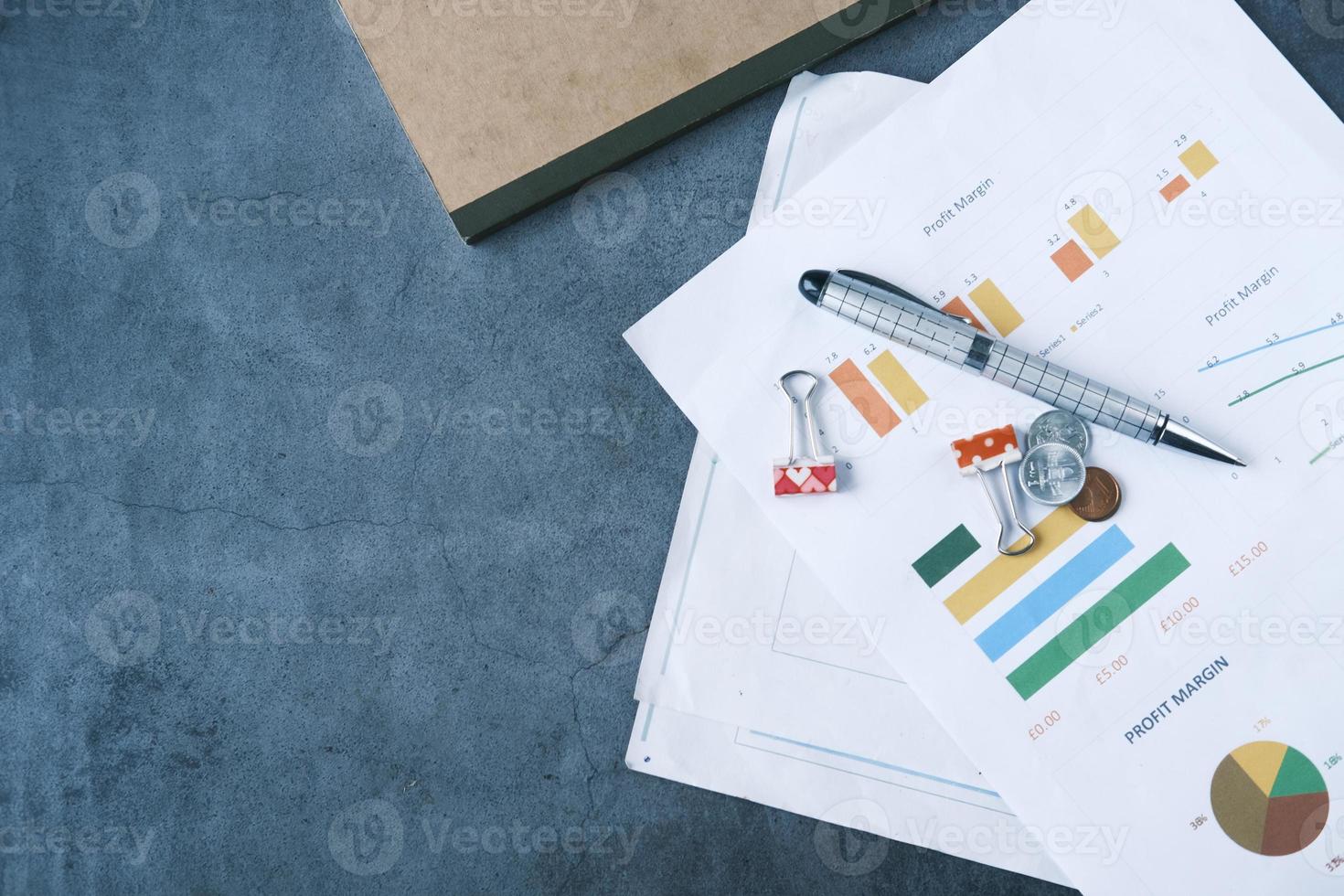 financial graph, calculator and notepad on table with copy space photo