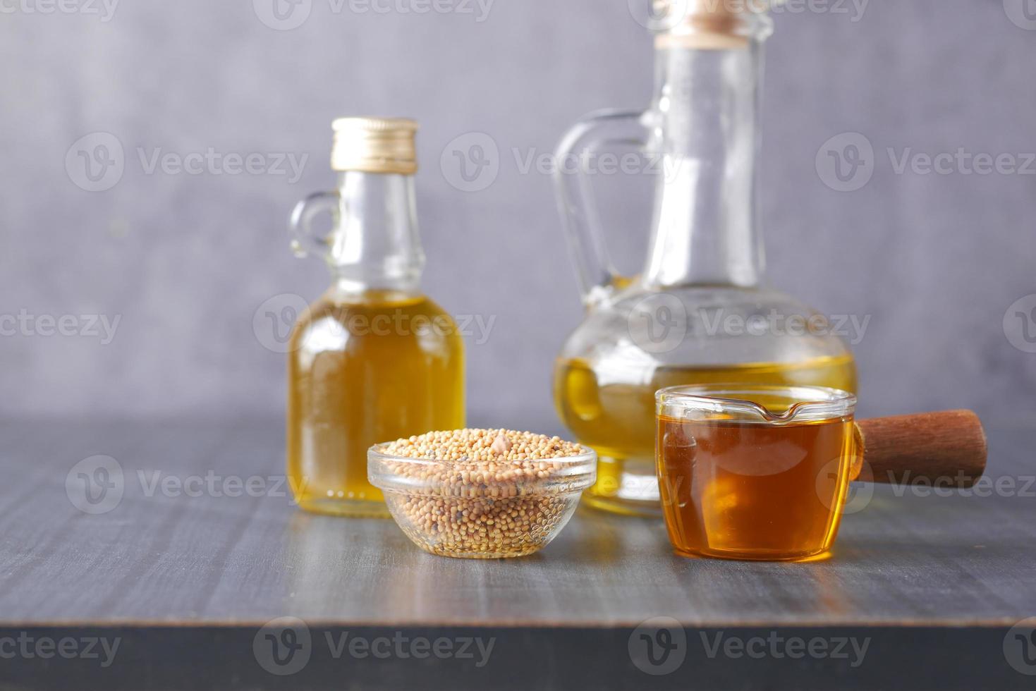 sunflower coking oil and seeds in a container on table photo