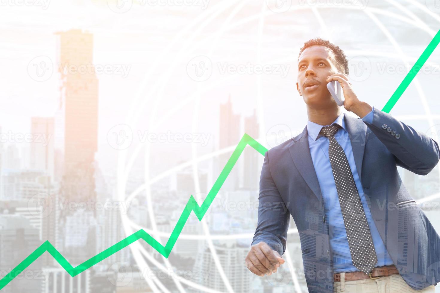 Business people using smartphone in city. Portrait of an handsome businessman. Modern businessman. Confident young man standing outdoors with cityscape in the background photo