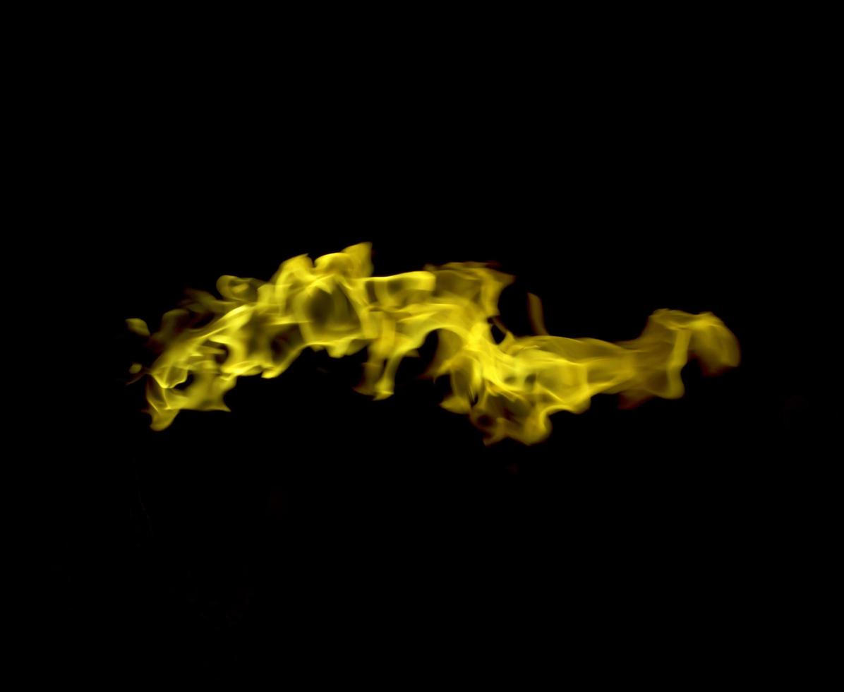 Fire flames on black background photo