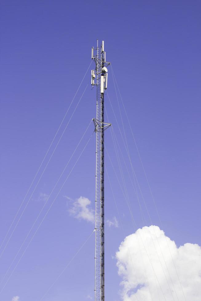 Cell phone tower and radio antenna. photo