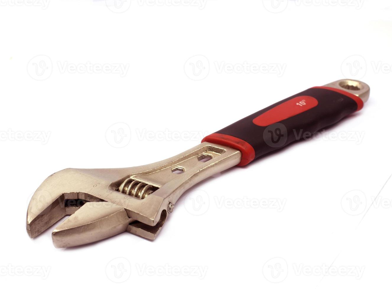 Adjustable wrench isolated on white background photo