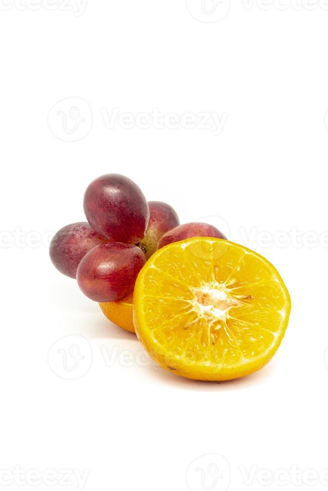Fresh citrus fruits and grapes on a white background photo