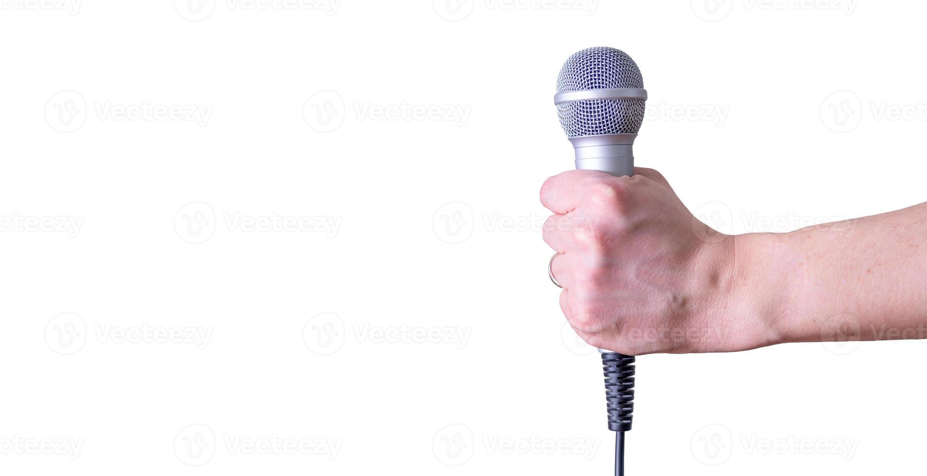 Female hand with microphone, on white background. photo