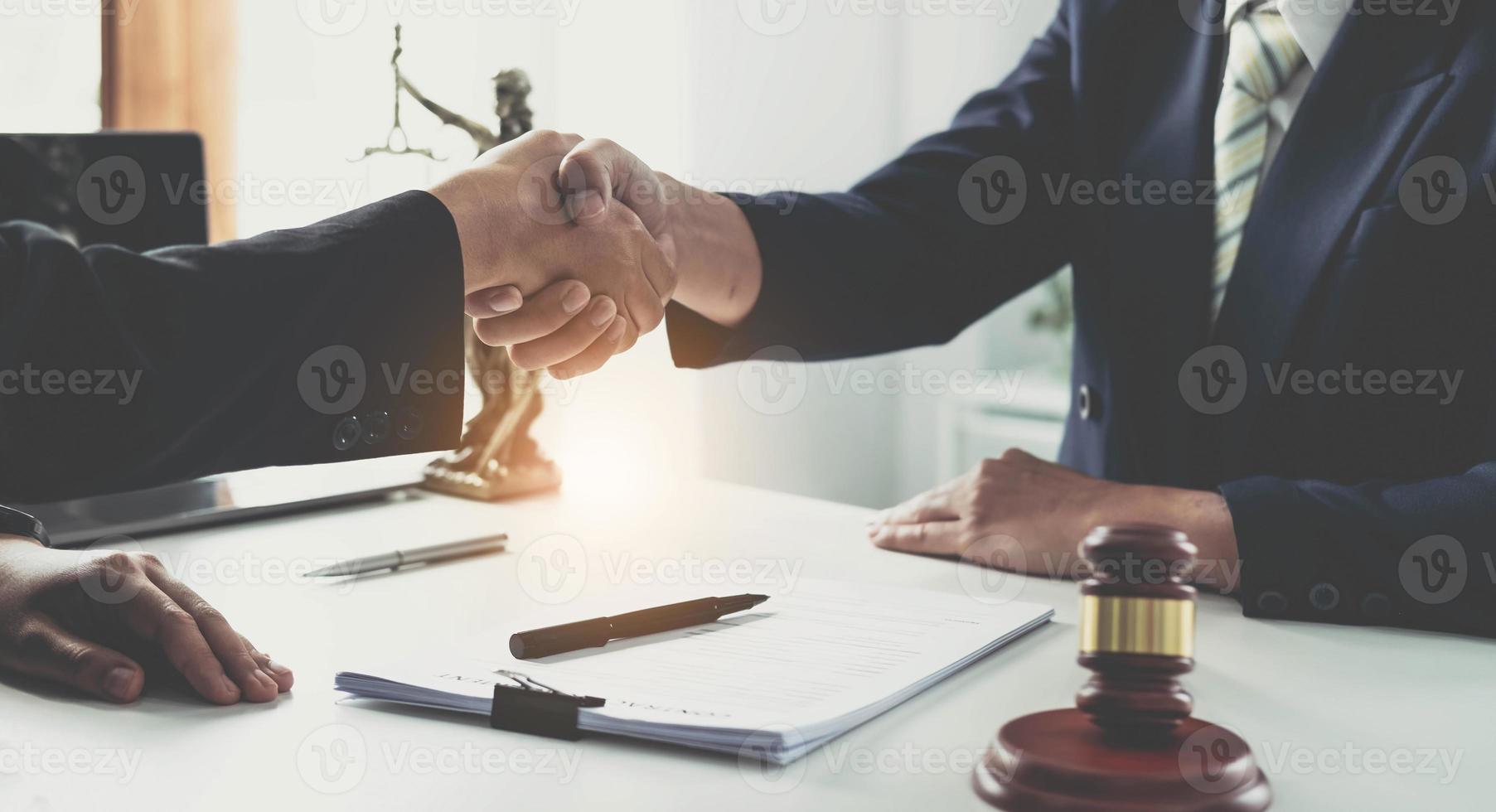 Handshake after good cooperation, Consultation between a male lawyer and businessman customer, tax and the company of real estate concept. photo