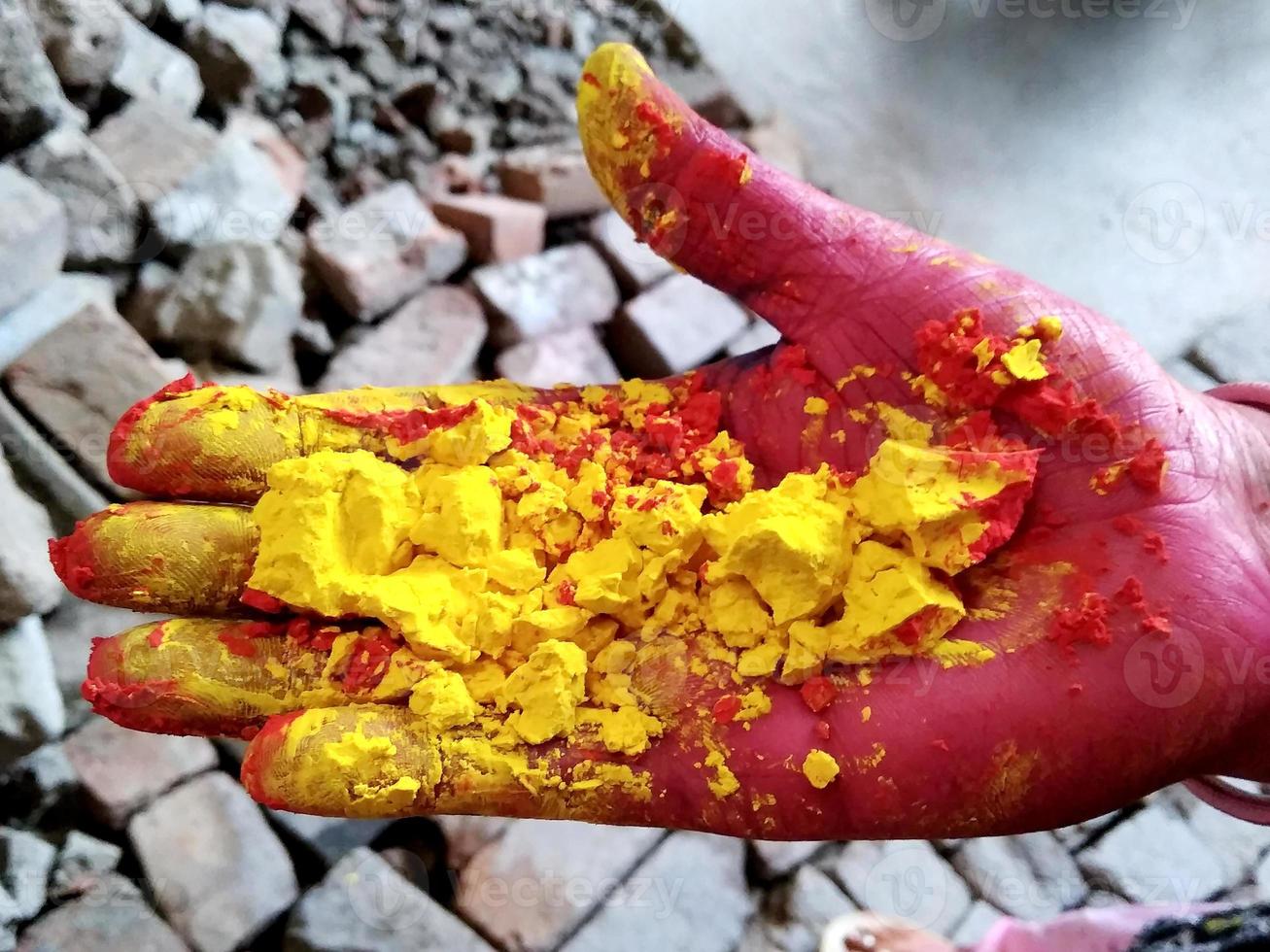 Female hands holding dry color powder photo