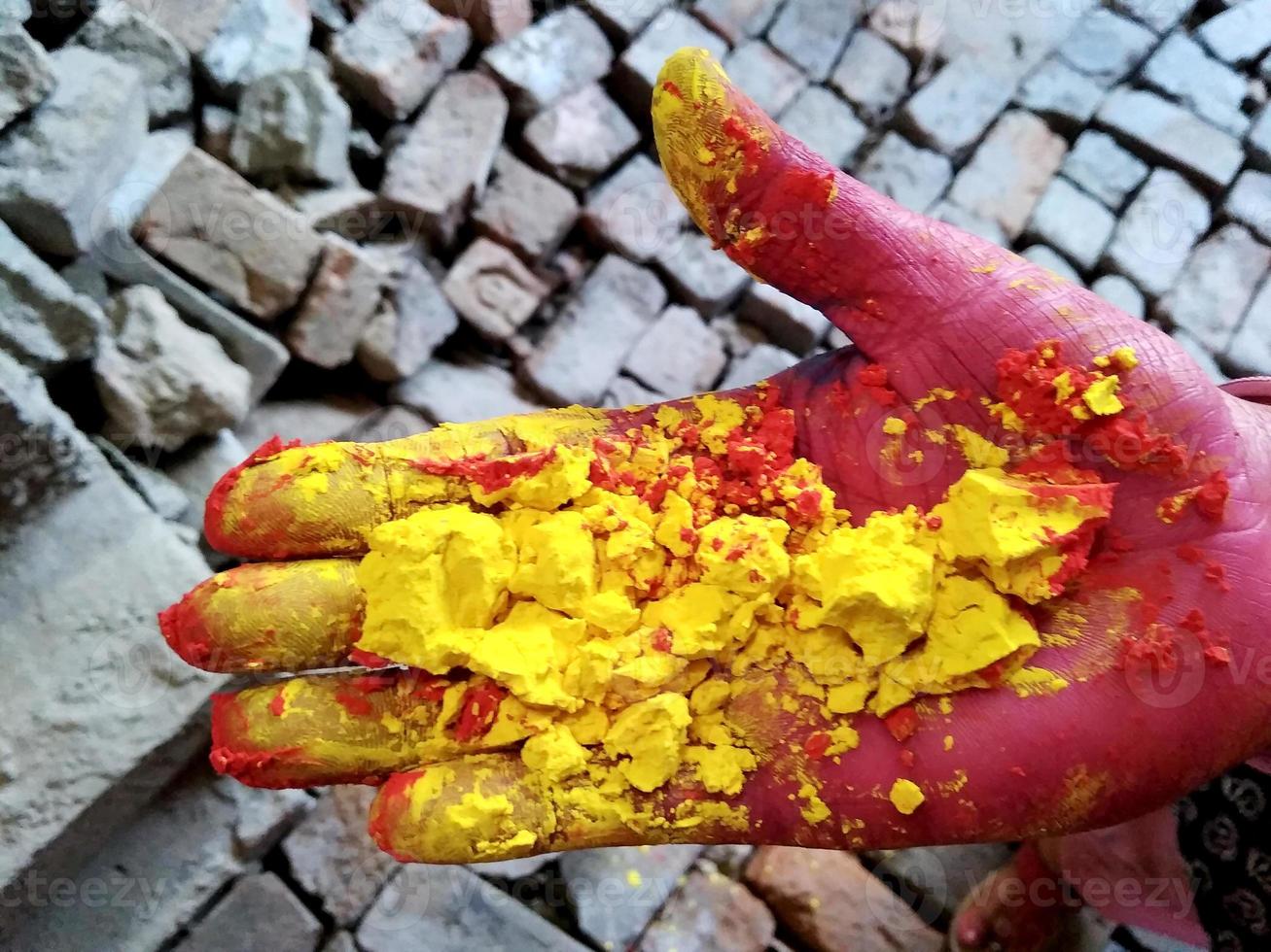 Female hands holding dry color powder photo