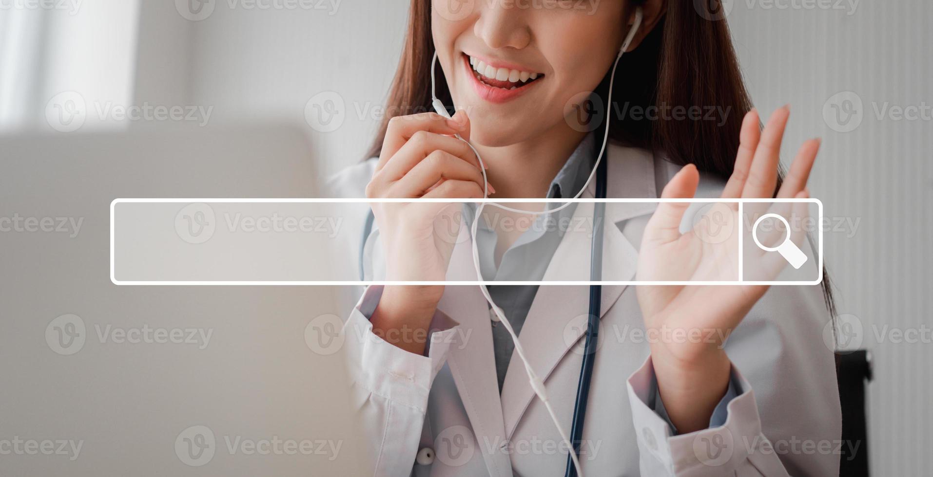 Asian woman doctor is online visiting with a patient on the internet application and Listening of the symptoms and explains how to treat the initial disease, Concept of Medical technology. photo