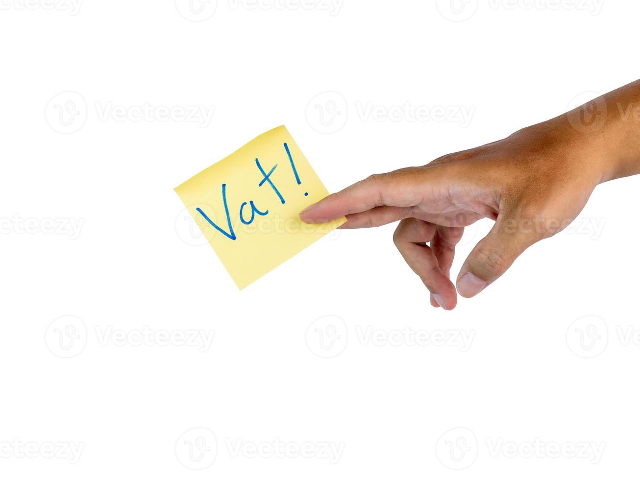 Hand holding a yellow note paper that says VAT is a warning about taxes. Ready to continue working and have clipping path on isolated background photo