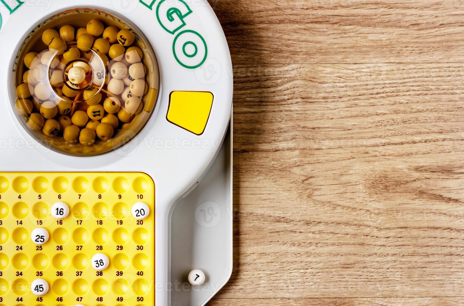 Electronic bingo game on wooden board. Horizontal image viewedfrom above. photo