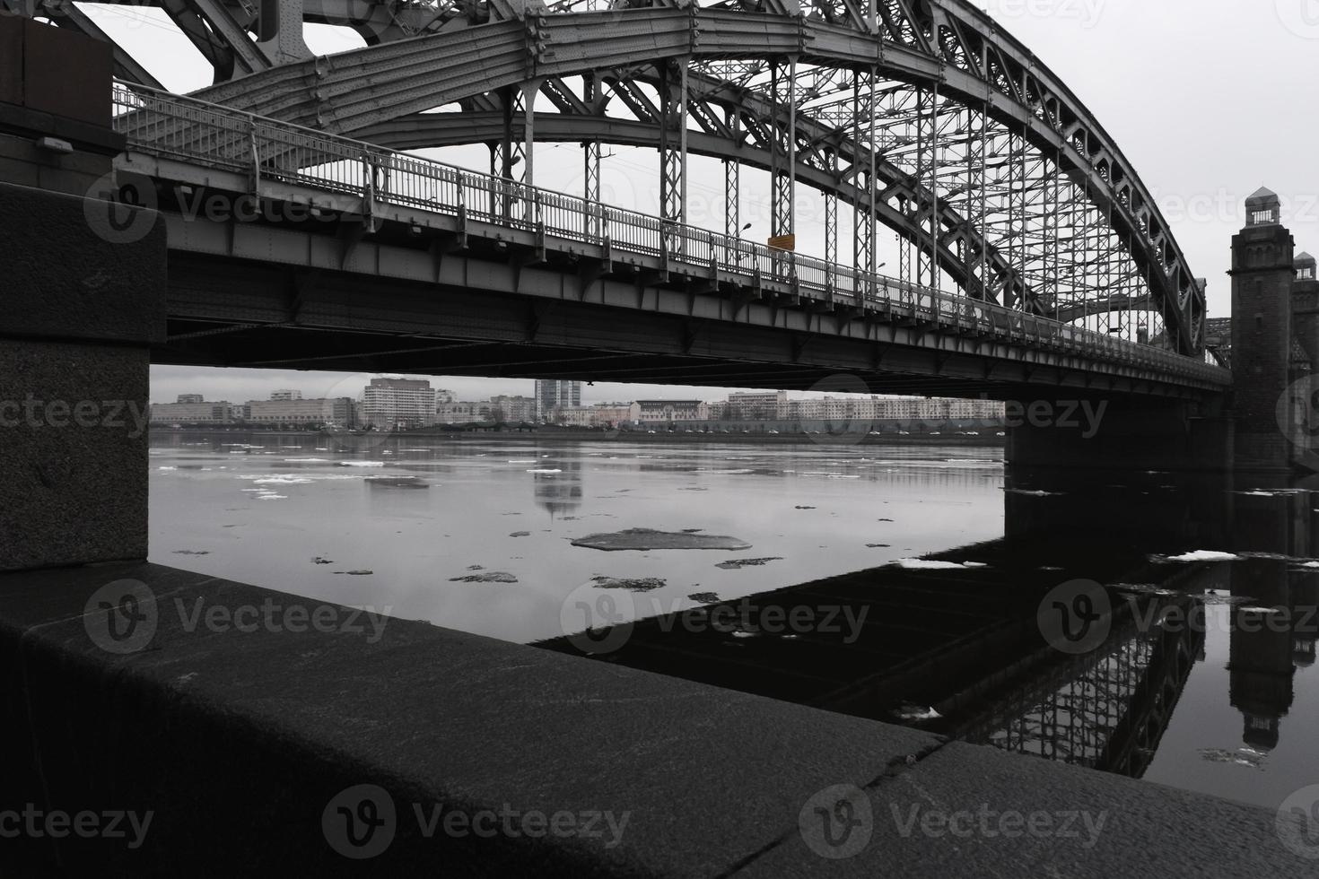 Panorama on a bridge over the river in the city, view from the bottom photo