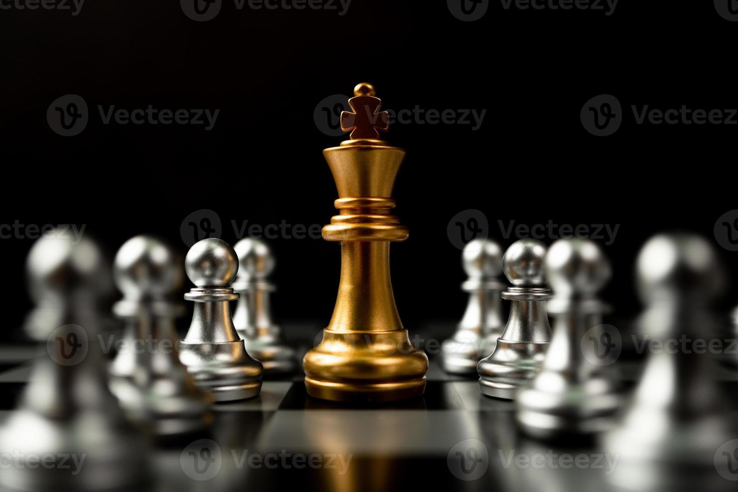 Golden Chess King standing to Be around of other chess, Concept of a leader must have courage and challenge in the competition, leadership and business vision for a win in business games photo