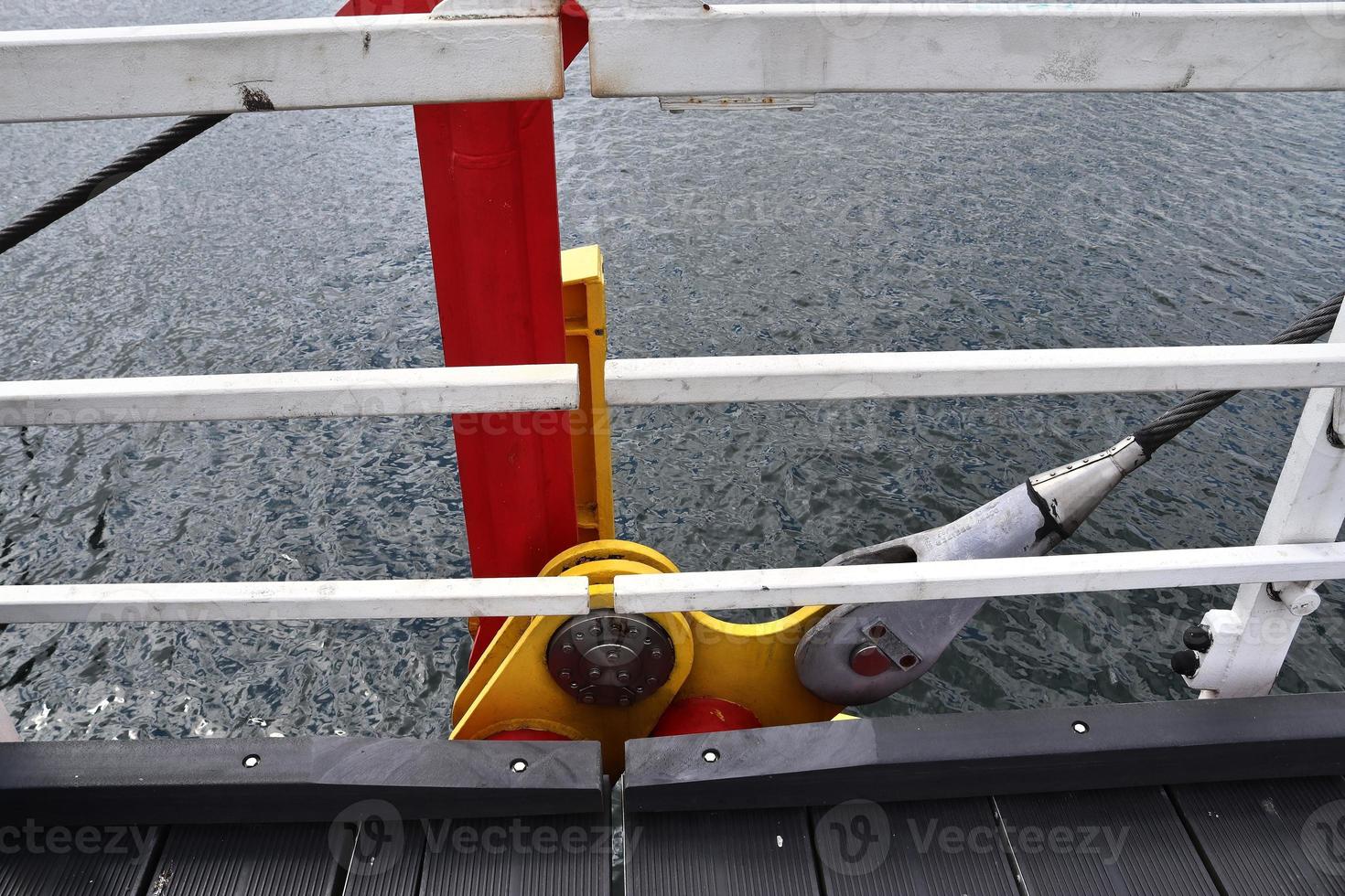 Different bollards and technical installations of vessel traffic at a port photo