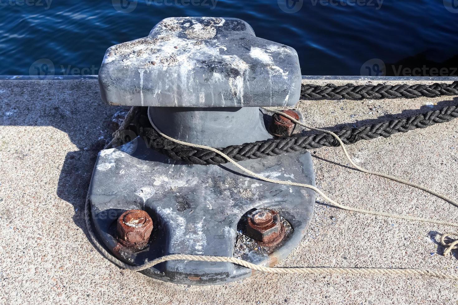 Different bollards and technical installations of vessel traffic at the Kiel port photo