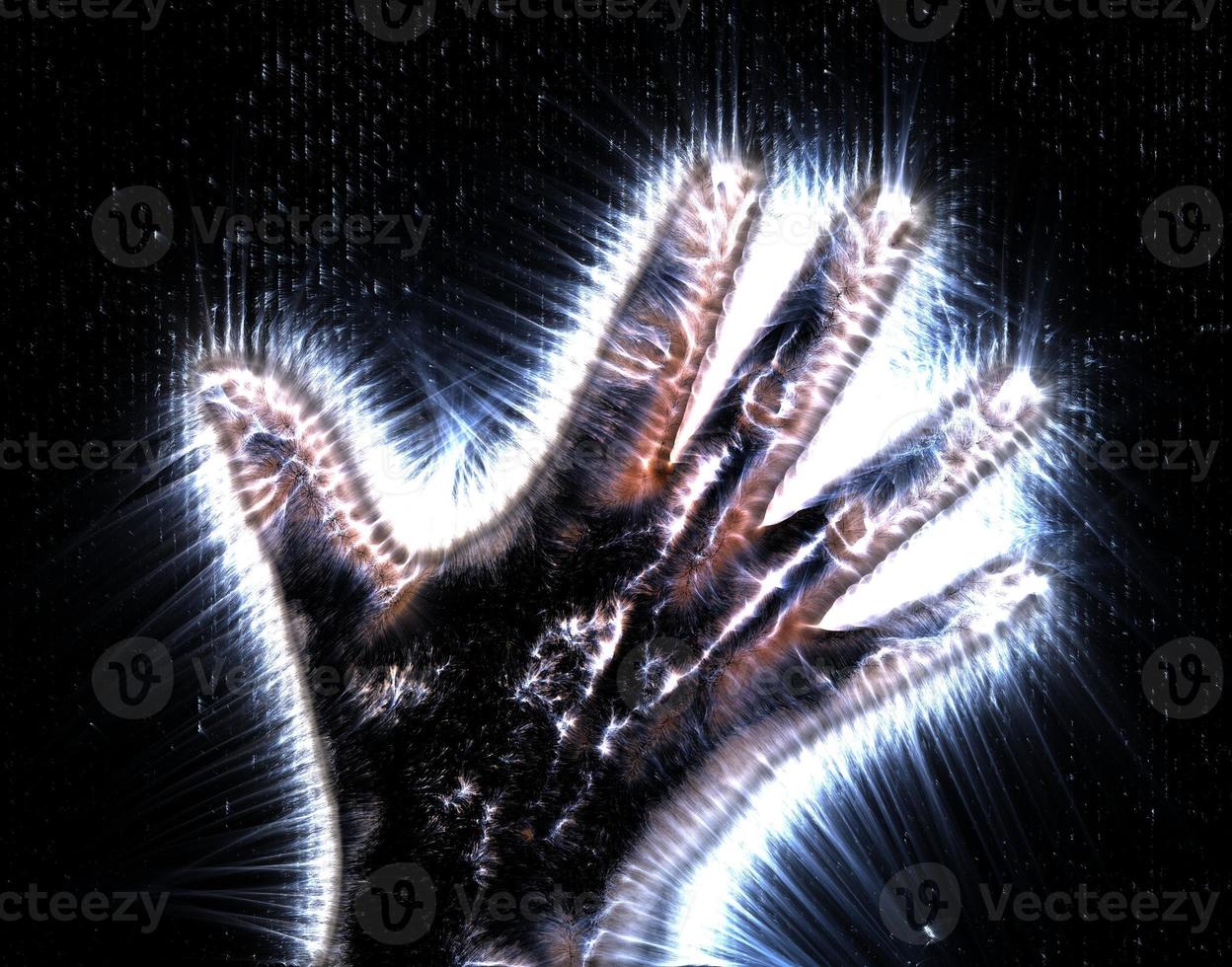 3D-Illustration of a glowing human female hand with a kirlian aura showing different symbols photo