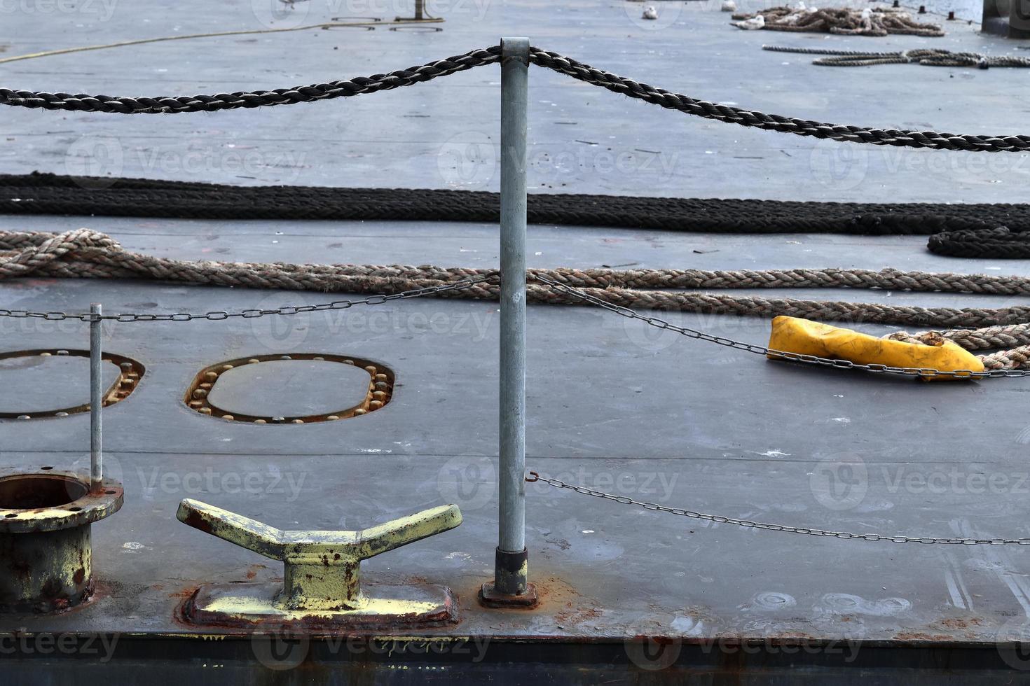 Different bollards and technical installations of vessel traffic at a port photo