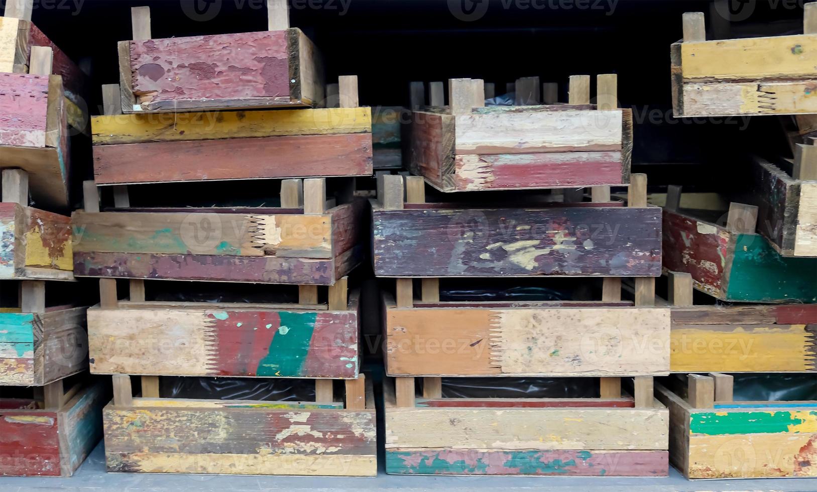Vintage wooden crates in a shelf for sale in a small shop. photo