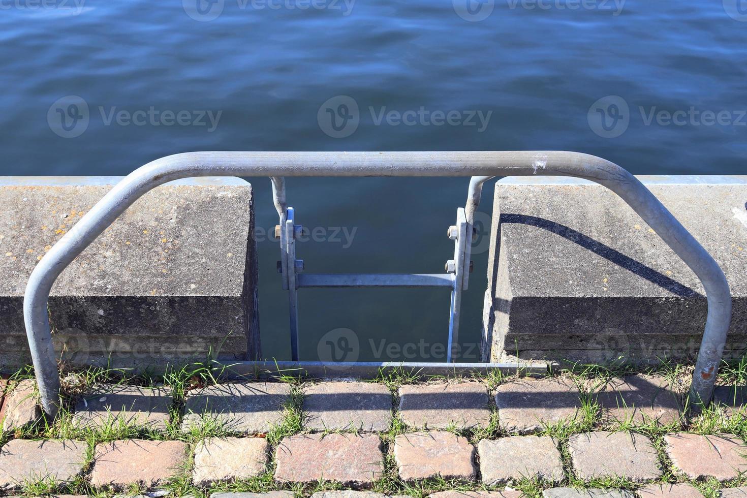 Different bollards and technical installations of vessel traffic at a port photo
