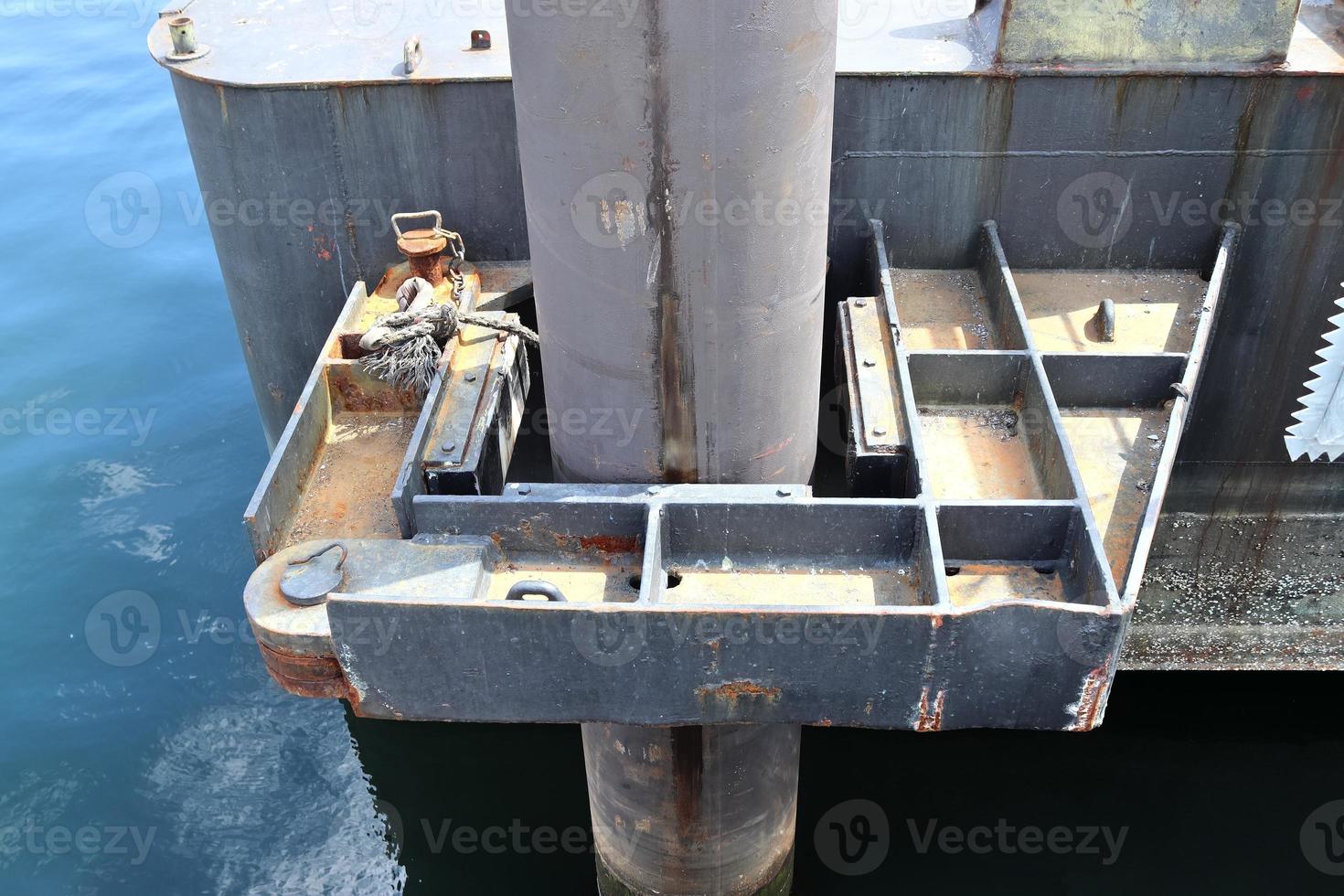 Different bollards and technical installations of vessel traffic at a port photo