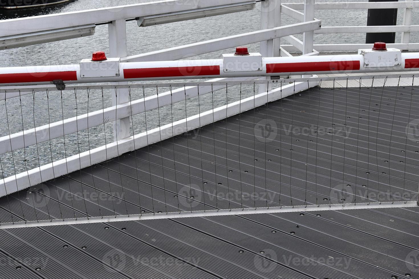 Different bollards and technical installations of vessel traffic at a port photo