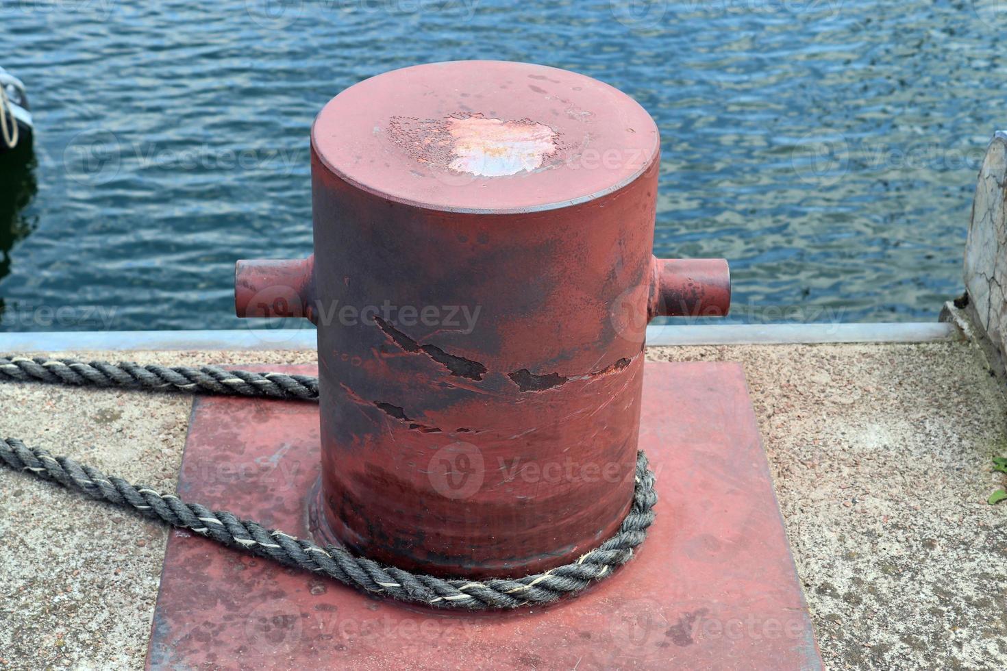 Different bollards and technical installations of vessel traffic at a port photo