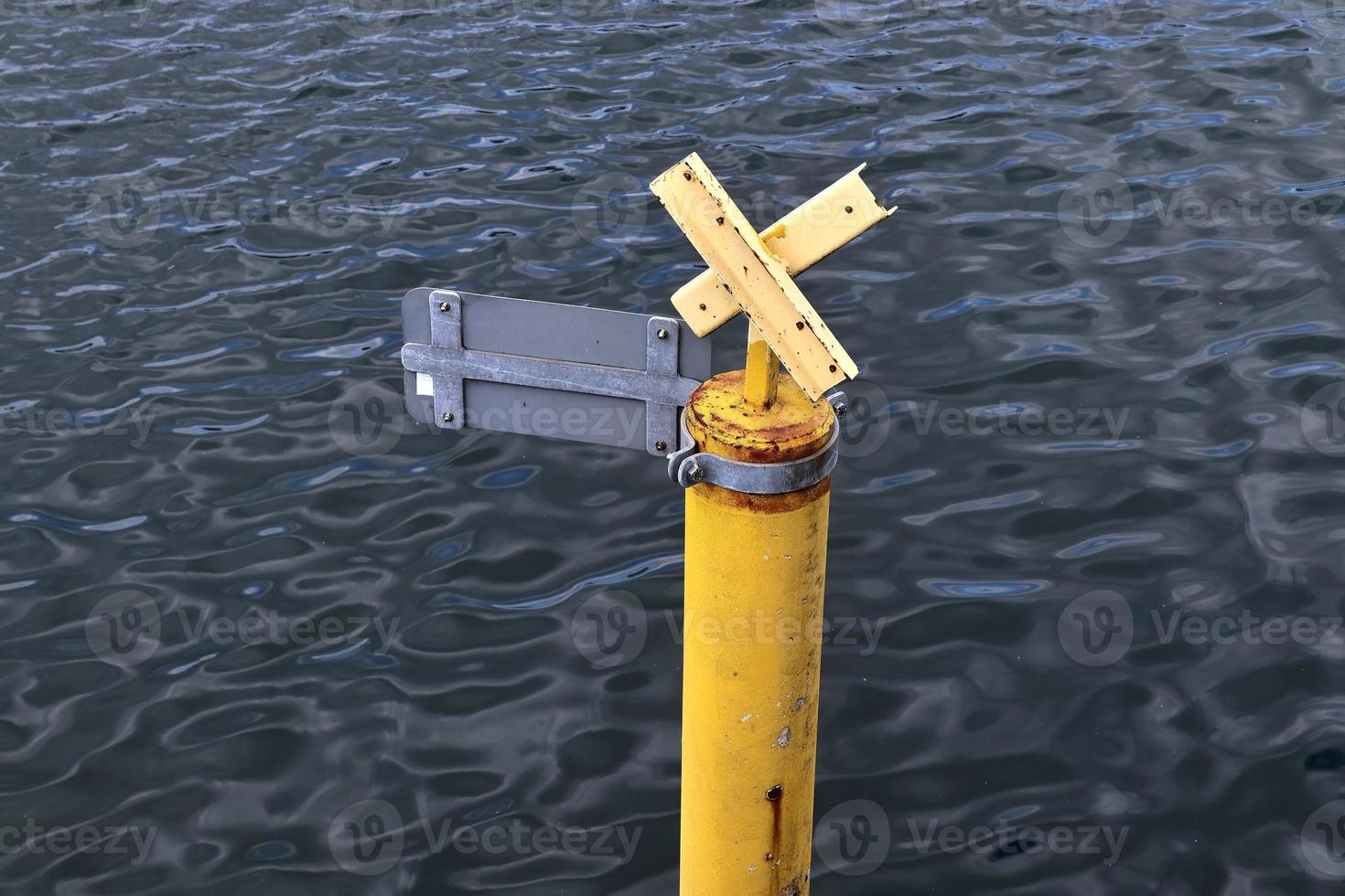 Different bollards and technical installations of vessel traffic at a port photo
