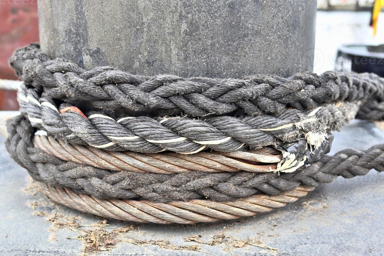 Detailed close up detail of ropes and cordage in the rigging of an old wooden vintage sailboat photo