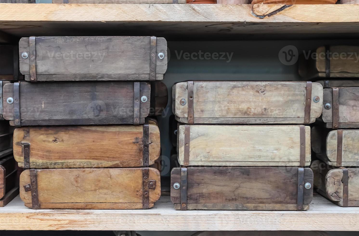 Vintage wooden crates in a shelf for sale in a small shop. photo